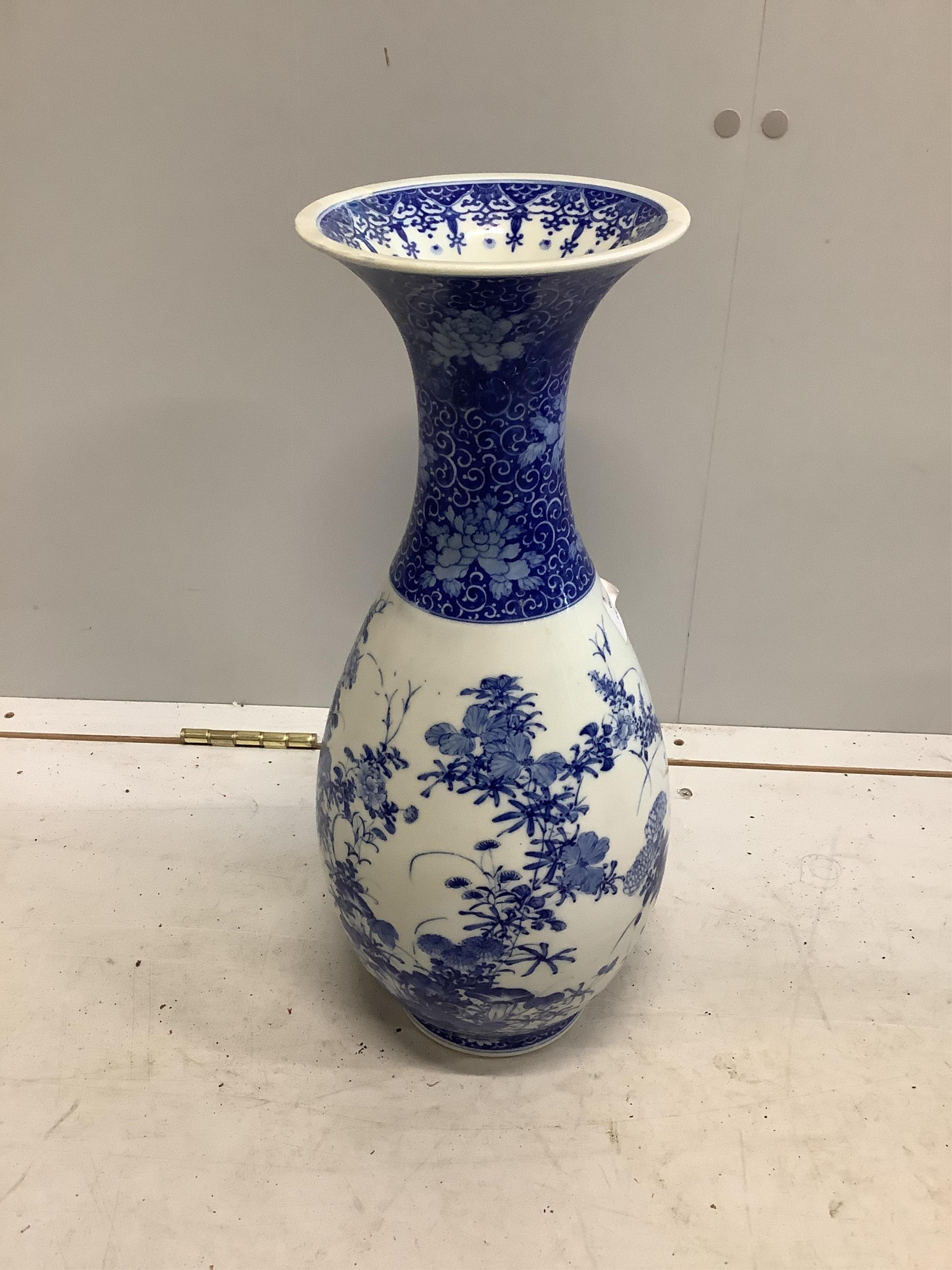 A large Japanese blue and white baluster vase, height 46cm. Condition - restoration to the rim